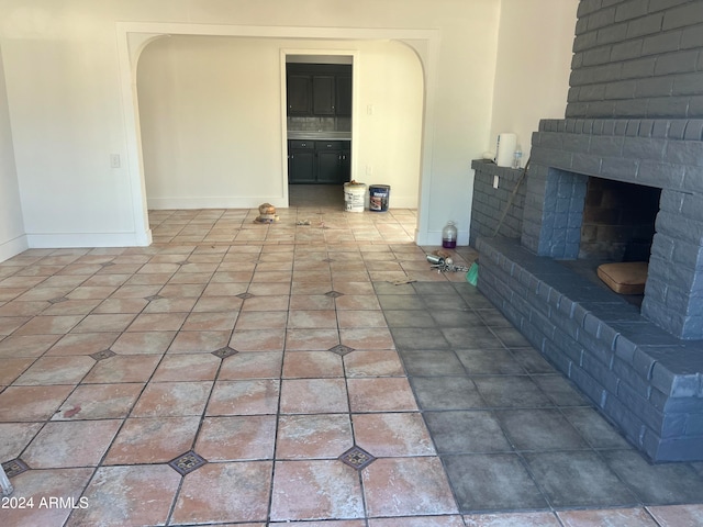 unfurnished living room featuring a fireplace