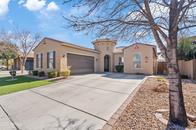 mediterranean / spanish-style house featuring a garage