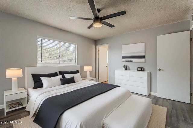 11210 S Bannock St, Phoenix, AZ 85044 - bedroom with baseboards, a textured ceiling, and dark wood finished floors