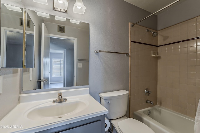 11210 S Bannock St, Phoenix, AZ 85044 - full bath featuring visible vents, a textured wall, toilet, and shower / washtub combination