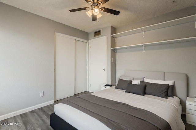 11210 S Bannock St, Phoenix, AZ 85044 - bedroom featuring baseboards, a ceiling fan, wood finished floors, and visible vents