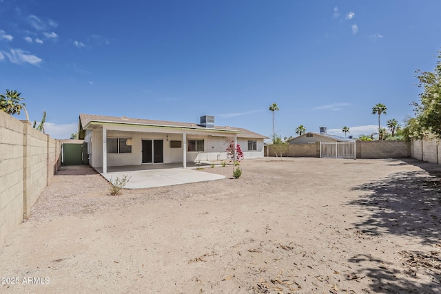 11210 S Bannock St, Phoenix, AZ 85044 - back of house featuring cooling unit, a fenced backyard, and a patio area