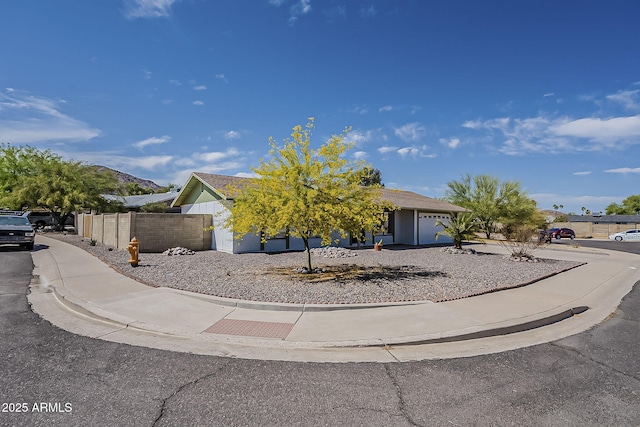 11210 S Bannock St, Phoenix, AZ 85044 - obstructed view of property with an attached garage and fence