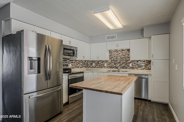 11210 S Bannock St, Phoenix, AZ 85044 - kitchen with a sink, wooden counters, stainless steel appliances, and dark wood-style floors
