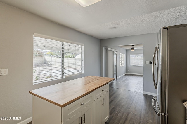 11210 S Bannock St, Phoenix, AZ 85044 - kitchen with ceiling fan, baseboards, white cabinets, freestanding refrigerator, and butcher block counters