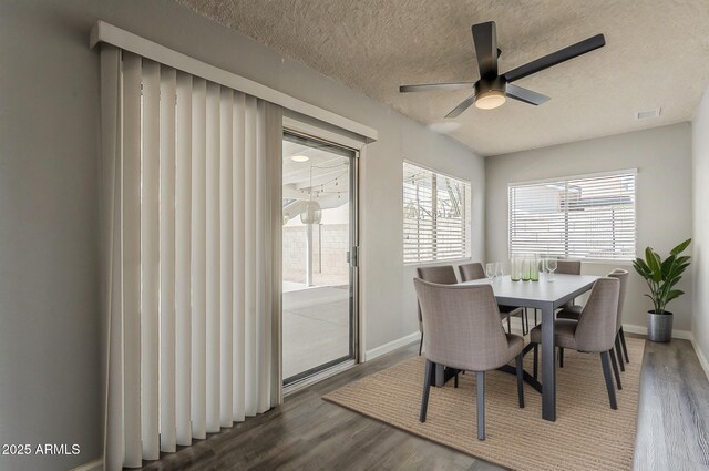 11210 S Bannock St, Phoenix, AZ 85044 - dining space featuring a textured ceiling, baseboards, ceiling fan, and wood finished floors