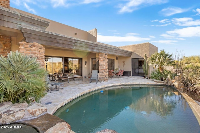 view of pool with a patio