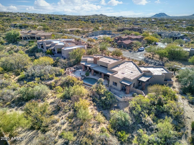 birds eye view of property featuring a mountain view