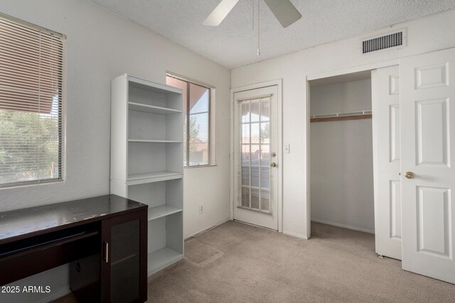 10235 N 31st St Unit 2, Phoenix, AZ 85028 - unfurnished office with light carpet, a ceiling fan, and a textured ceiling