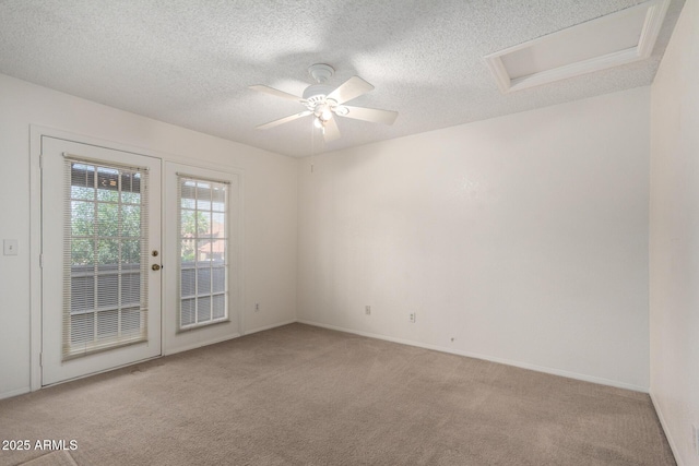 10235 N 31st St Unit 2, Phoenix, AZ 85028 - carpeted empty room with attic access, a textured ceiling, and ceiling fan