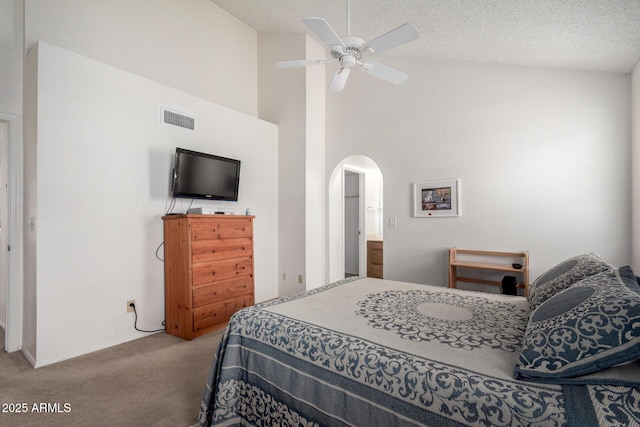 10235 N 31st St Unit 2, Phoenix, AZ 85028 - bedroom with carpet floors, arched walkways, high vaulted ceiling, and a ceiling fan