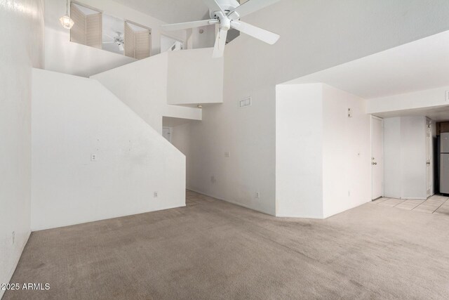 10235 N 31st St Unit 2, Phoenix, AZ 85028 - unfurnished room featuring light carpet, a ceiling fan, and a towering ceiling
