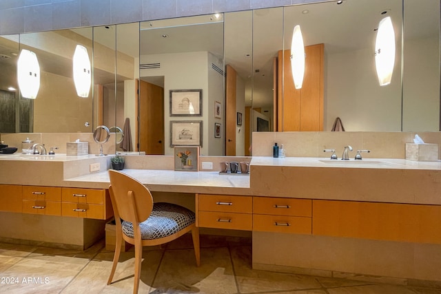 bathroom featuring backsplash, sink, and tile patterned flooring