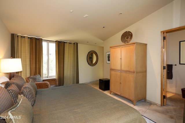 bedroom featuring lofted ceiling