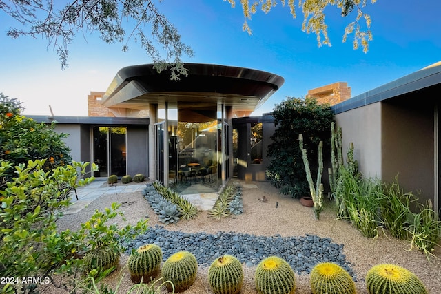 back of house with a patio