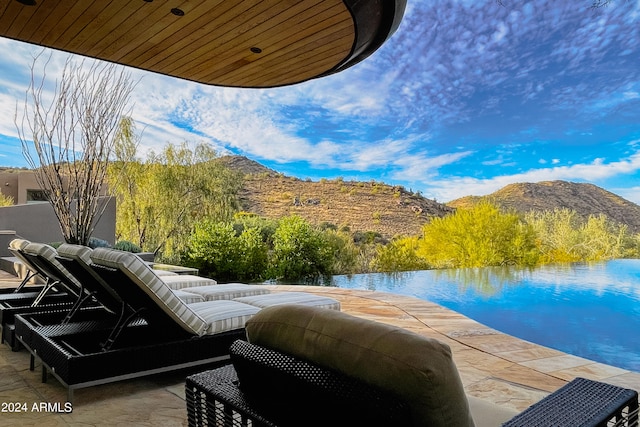 view of patio / terrace featuring a mountain view