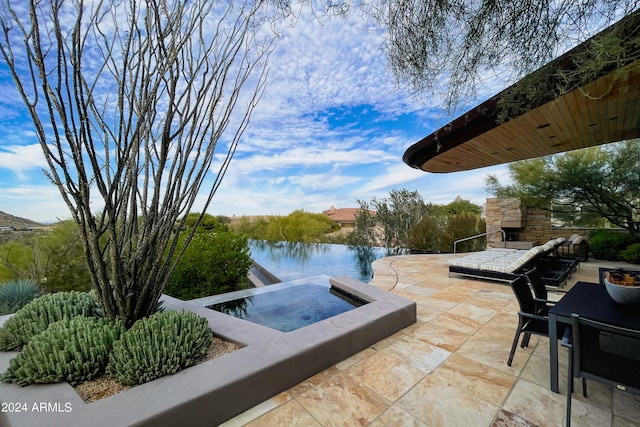 view of patio featuring a water view