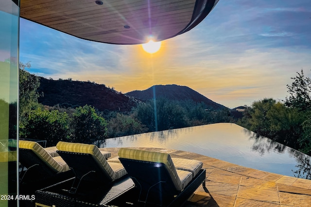 patio terrace at dusk with a mountain view