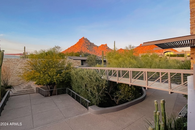 view of patio / terrace featuring a mountain view