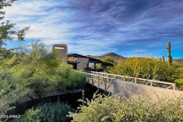 view of property exterior with a mountain view