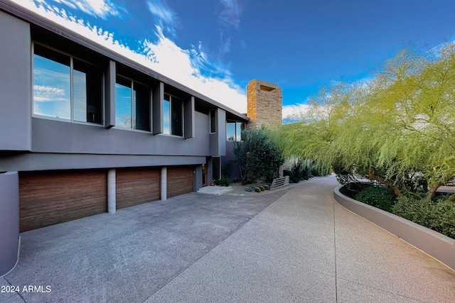 view of property exterior with a garage