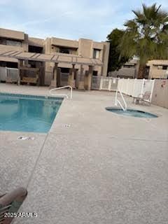 view of swimming pool with a patio area