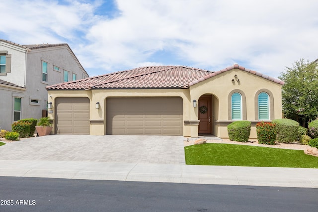 24226 N 22nd St, Phoenix, AZ 85024 - mediterranean / spanish house featuring stucco siding, a garage, a tile roof, and decorative driveway