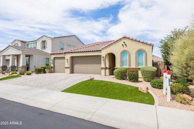 24226 N 22nd St, Phoenix, AZ 85024 - mediterranean / spanish house with an attached garage, decorative driveway, stucco siding, and a tile roof