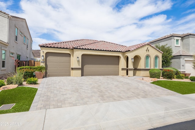 24226 N 22nd St, Phoenix, AZ 85024 - mediterranean / spanish house with stucco siding, decorative driveway, a tile roof, and a garage