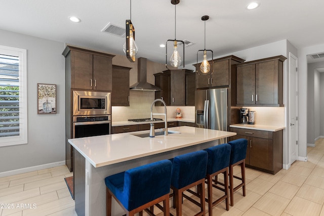 24226 N 22nd St, Phoenix, AZ 85024 - kitchen with wall chimney exhaust hood, stainless steel appliances, baseboards, a sink, and recessed lighting