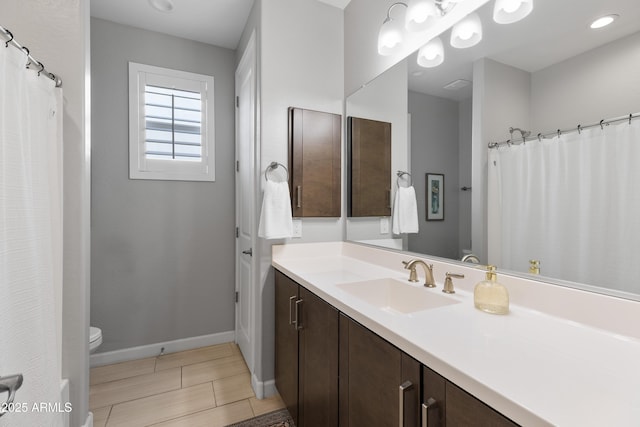 24226 N 22nd St, Phoenix, AZ 85024 - full bathroom with toilet, vanity, and baseboards
