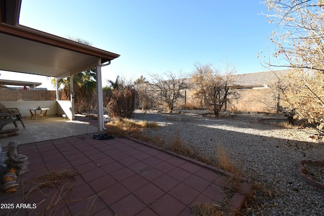 view of patio / terrace featuring fence