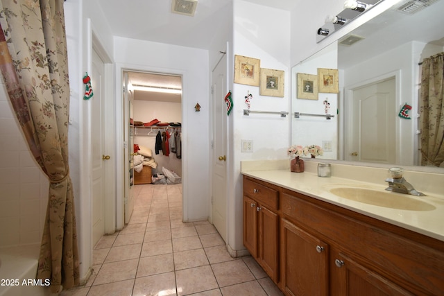 full bathroom featuring vanity, tile patterned flooring, visible vents, and a shower with curtain