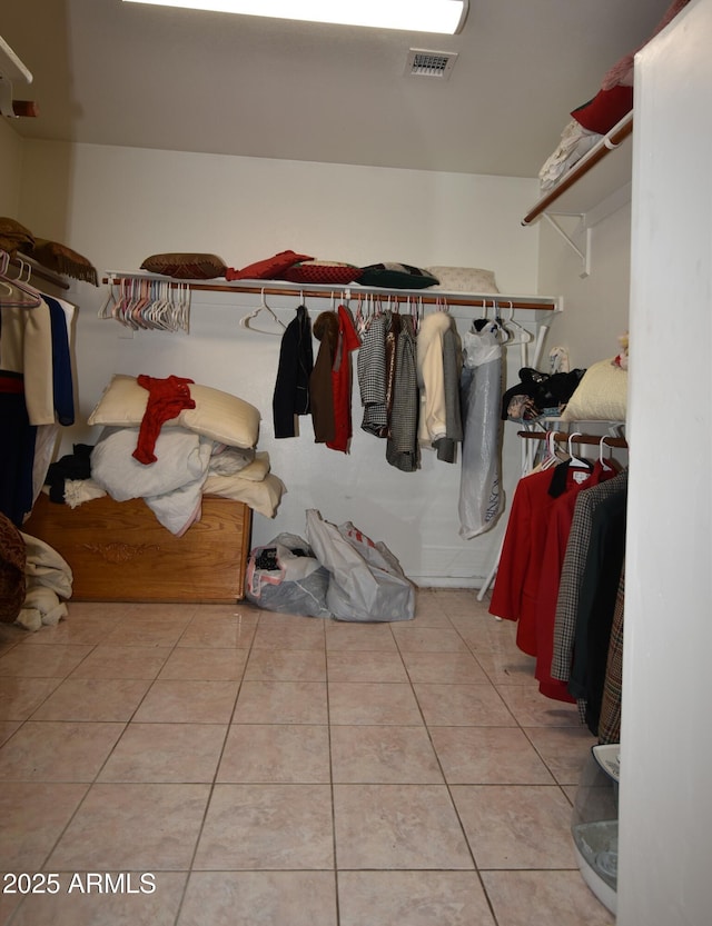 walk in closet featuring tile patterned flooring and visible vents