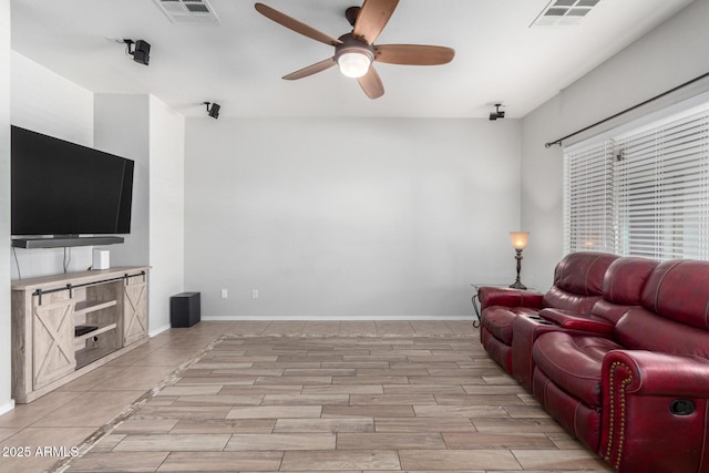 living room featuring ceiling fan