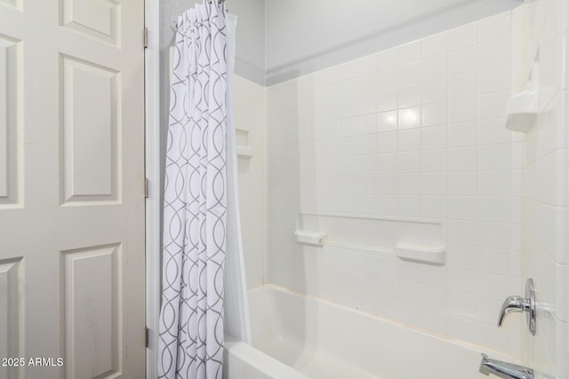 bathroom featuring shower / bathtub combination with curtain