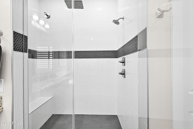 bathroom featuring a shower stall