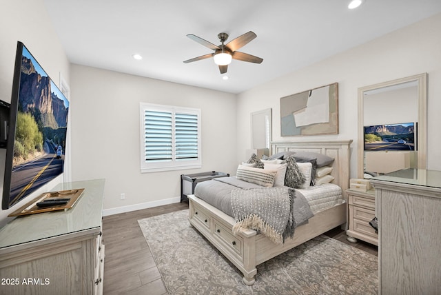 bedroom with dark wood-type flooring, recessed lighting, baseboards, and a ceiling fan