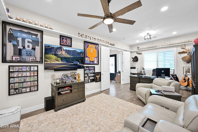 living area with recessed lighting, ceiling fan, baseboards, and wood finished floors