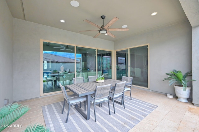 view of patio with a ceiling fan and outdoor dining area