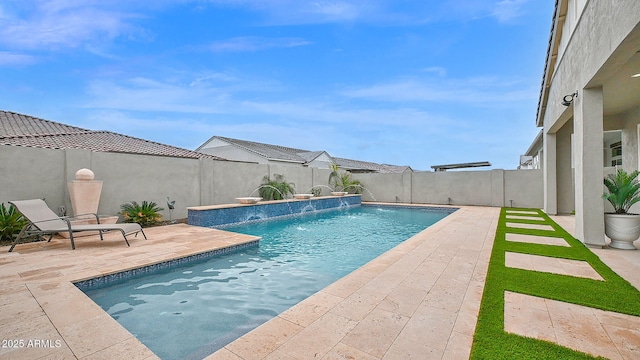 view of swimming pool featuring a fenced in pool, a fenced backyard, and a patio