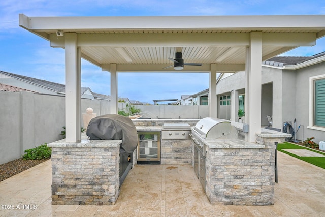 view of patio / terrace featuring a fenced backyard, ceiling fan, and area for grilling