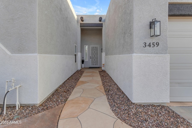 entrance to property featuring a garage