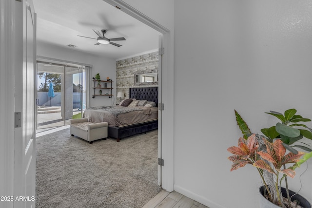 carpeted bedroom with access to exterior and ceiling fan