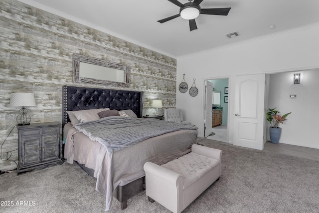 bedroom with light colored carpet, ornamental molding, and ceiling fan