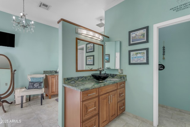 bathroom featuring vanity, tile patterned flooring, and ornamental molding