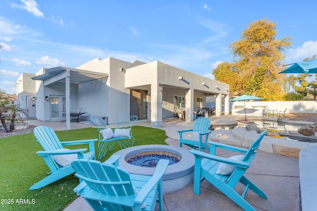 view of patio with an outdoor fire pit