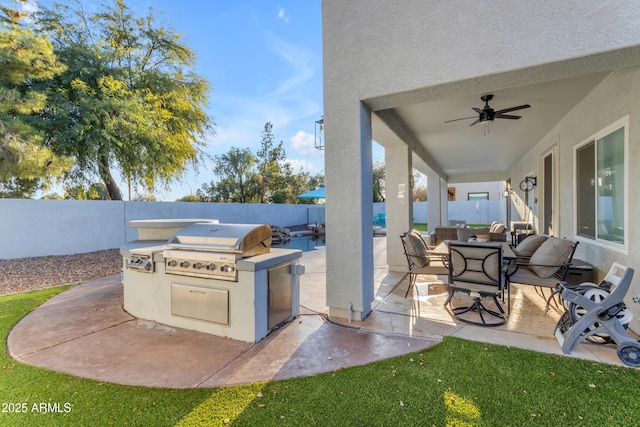 view of patio / terrace featuring area for grilling and ceiling fan