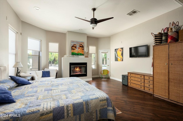 bedroom with ceiling fan and dark hardwood / wood-style flooring