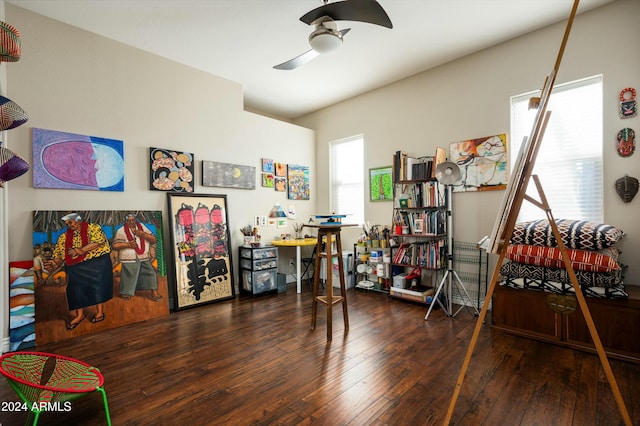 game room featuring a wealth of natural light, dark wood-type flooring, and ceiling fan